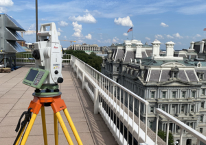 Leica total station on a building rooftop surveying historic Mills Building in Washginton, DC