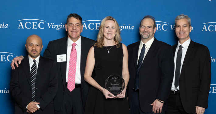 ATCS team holding glass award at the ACEC VA 2024 Engineering Excellence Award Gala